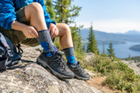 Hiker’s Boots Above the Mountain Lake